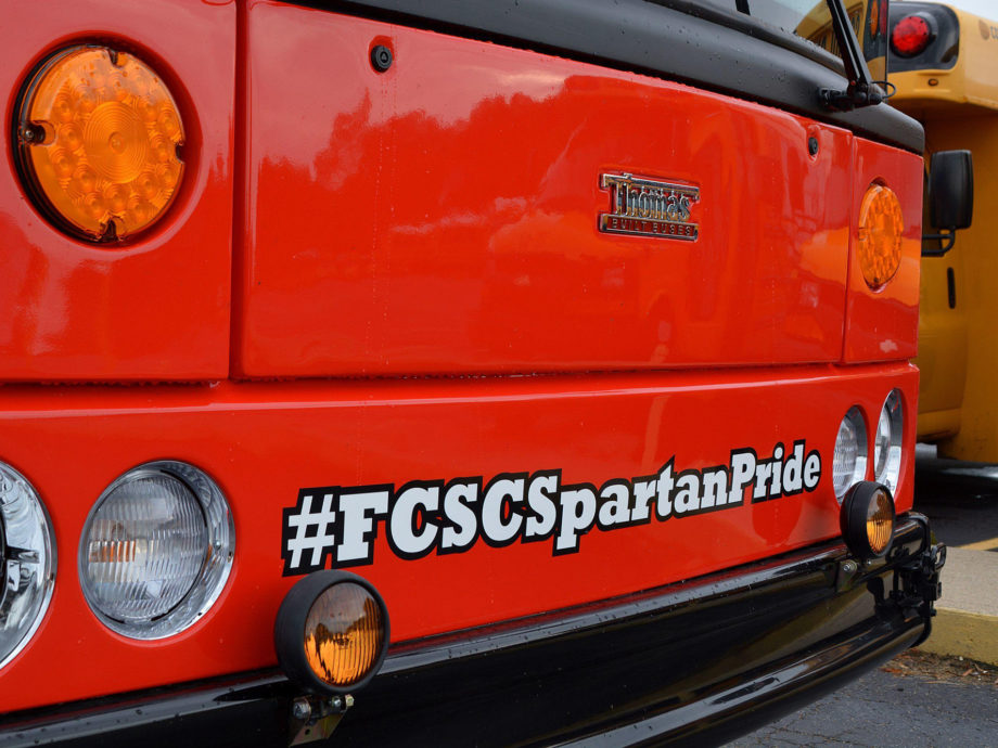 Hashtag — FCSCSpartanPride; front of Thomas-Built Bus
