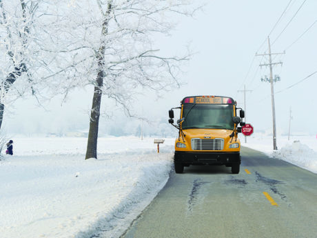 bus in snow with Insta-Chain Automatic Tire Chains